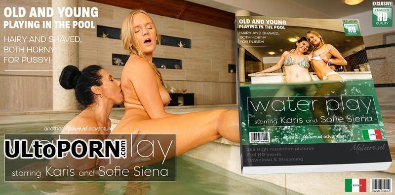 Mature.nl: Karis (21), Sofia Siena (EU) (46) - Young shaved babe eating a hairy mature pussy at the pool [349 MB / HD / 720p] (Lesbian)